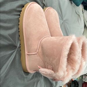 light pink UGG’s with bow in back.